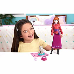 Disney Frozen Anna Fashion Doll & Wolf Cub Figure with 4 Nurturing Accessories Inspired by Movie